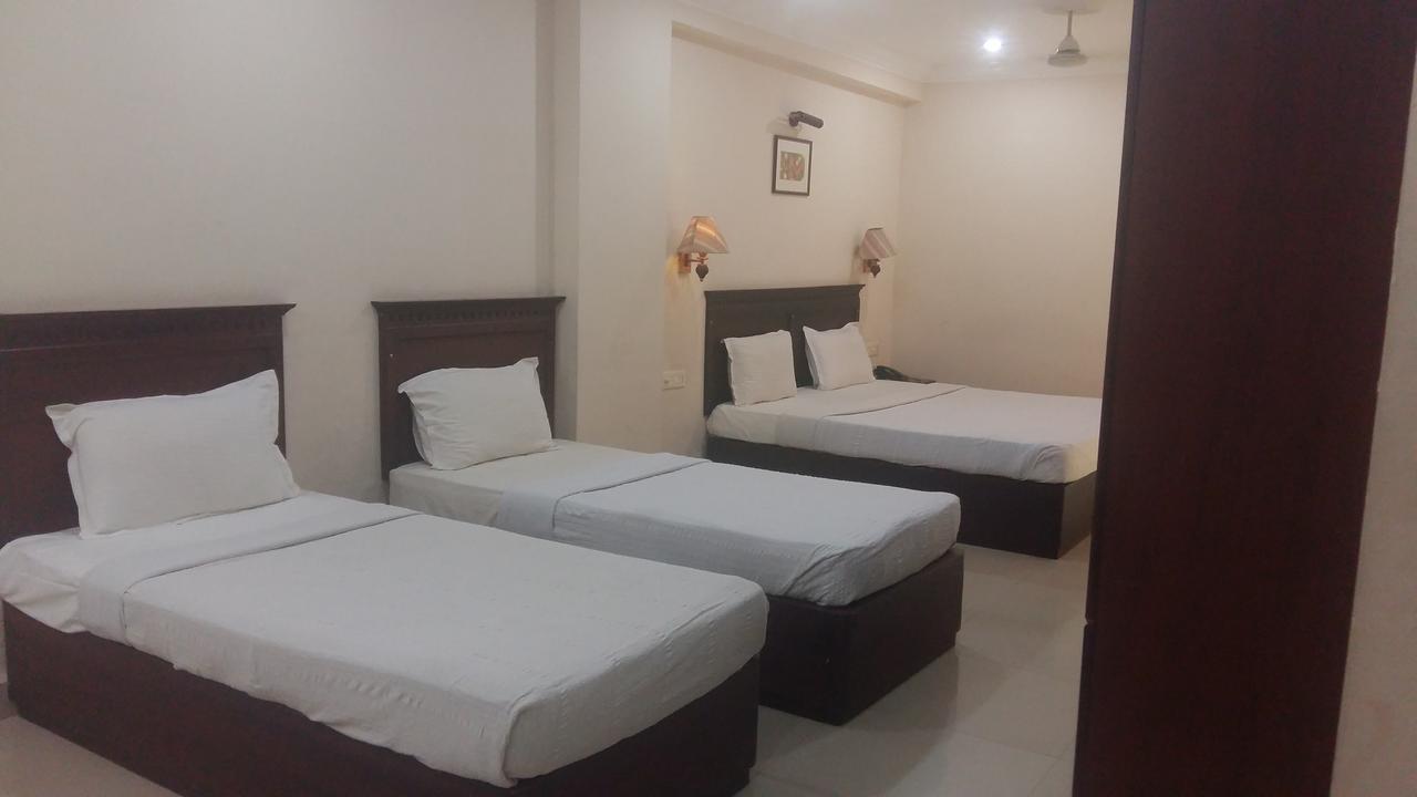 Hotel Horizon International Guruvāyūr Quarto foto